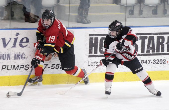 Colin MacSween of the Saint John Vitos and Patrick Landry of the Moncton Flyers are shown during one of their N.B. championship games. The Saint John Vitos won the N.B. title to advance to this week’s Atlantic Major Midget Hockey Championship at the Wellness Centre. 